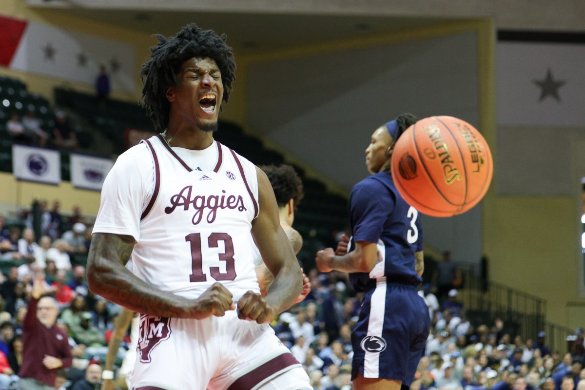 Texas A&M Aggies forward Solomon Washington (13) reacts after dunking the ball against the Penn State Nittany Lions in the second half during the ESPN Events Invitational at State Farm Field House in Kissimmee, Fla., on Nov. 23, 2023.